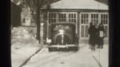 Danielson Connecticut (1939): People Walking Towards An Older Parked Vehicle As A