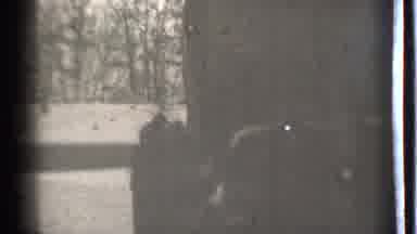 Danielson Connecticut (1939): Person Walking Towards The Camera With A Child In