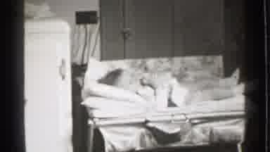Danielson Connecticut (1939): A Baby Nursing On A Bottle Reclines On A Changing
