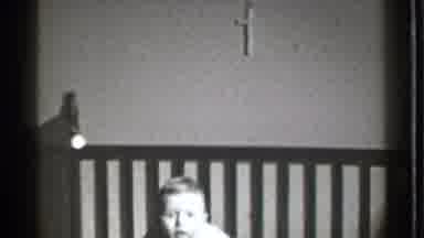 Danielson Connecticut (1939): Little Black And White Baby Sitting In The Crib And