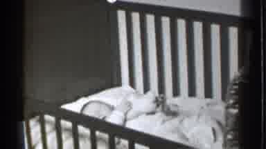 Danielson Connecticut (1939): Adorable Baby Relaxing With Comfortable Clothes In A