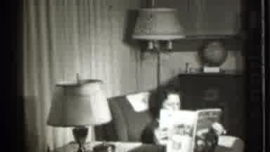 Danielson Connecticut-1939: Woman In Dress Reading Magazine In Living Room