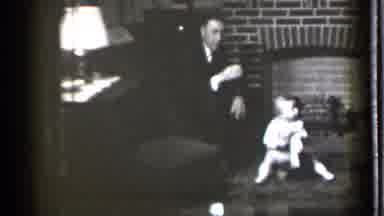 Danielson Connecticut (1939): Man And Baby Sitting By A Fireplace