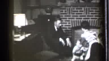 Danielson Connecticut (1939): Woman Wearing Silver Shirt Lifts Baby Off Wooden