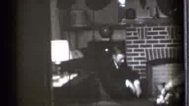 Danielson Connecticut (1939): A Man In A Suit Wearing Glasses Sits In A Chair And