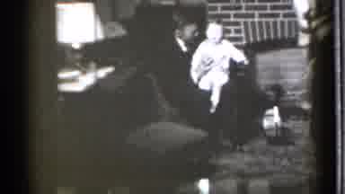 Danielson Connecticut (1939): Man With A Baby Woman Approaches And Puts Pacifier