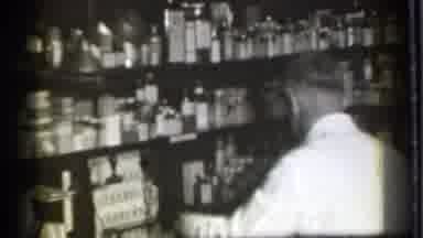 Danielson Connecticut (1939): Man Pouring Liquid