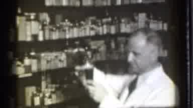 Danielson Connecticut (1939): Man Wearing White Shirt Measuring Liquid In Flask