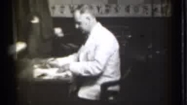 Danielson Connecticut (1939): Man Wearing White Cot Sits At Desk Writing Nonperson