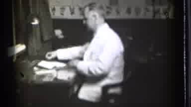 Danielson Connecticut (1939): Dogcatcher Man Preps Room Chair Sitting