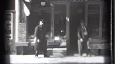 Danielson Connecticut (1939): Man Wearing Grey Ants Kicks At Police Officer On