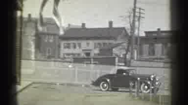 New York (1939): Car Driving Backwards In Father Of Some Buildings
