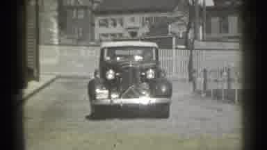 New York (1939): Film Of Vintage Car Driving Towards Comer A Turning Way