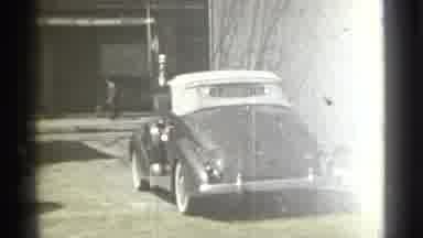 New York (1939): Car Driving Down The Road With People Crossing The Street