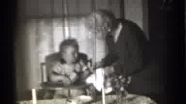 New York (1939): Woman Cleaning Spoon And Handing It To Child