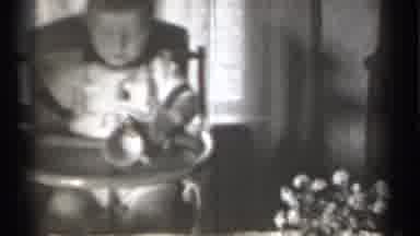 New York (1939): Baby Sitting On High Chair And Lady Eating