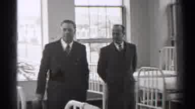 San Francisco California (1944): Two Well Dressed Men Walking Slowly Through