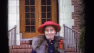 San Francisco California (1944): Older Woman In Red Hat Walks To Clinic Entrance