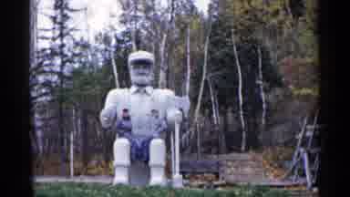 Michigan USA (1960): People Sitting On Int Statue While Wiring Air Caricature Ken