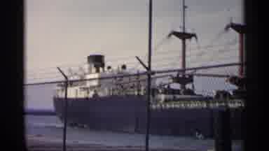 Michigan USA (1960): In Sea Big And Huge Ship Is Moving Slowly And Steely Taking