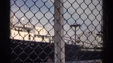 Michigan USA (1960): Large Ship Through Chain Link Fence