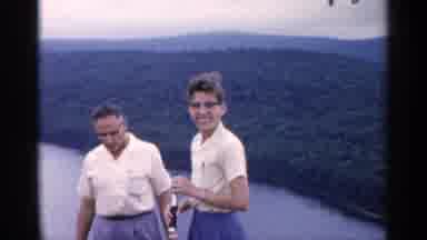 Michigan USA (1960): Two Men With Small Telescope Enjoy Mountains And Water