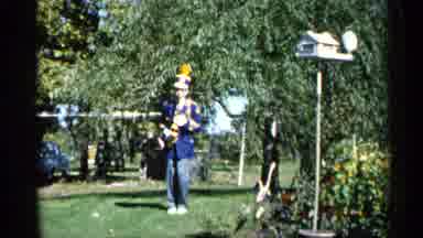Michigan USA (1960): Person Standing Outside Marching In Pace While Holding A