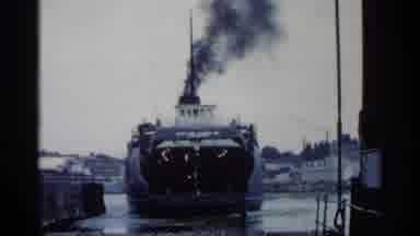 Michigan USA (1960): Ship Coming Into Other Old Car Driving On Riley Truck