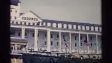 Michigan USA (1960): Large White Building Lined With Man United States Flags