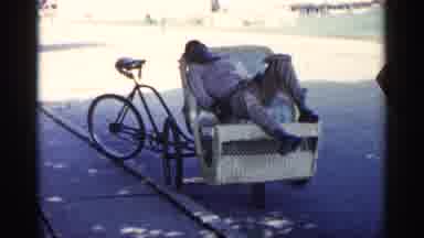 Michigan USA (1960): Hothouse Dawn Bus Carries People Down Street Man Sleeps In