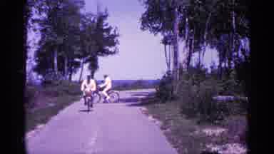 Michigan USA (1960): Couple Enjoying Riding Air Bicycles On Nice Spring Day