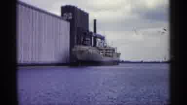 Minnesota USA (1961): White Ship Sitting In Water Next To White And Grey Building