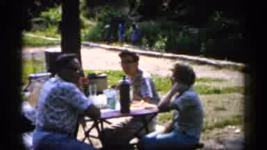 Minnesota USA (1961): Some People Sitting At Park Table Eating Together Some Food