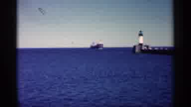 Minnesota USA (1961): Very Large Ship Moving Thenceforward With Lighthouse On
