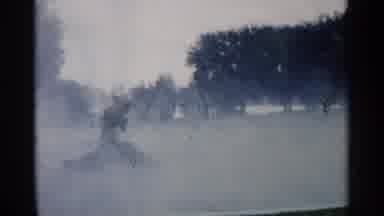 Minnesota USA (1961): Green Park With Fog Surrounding Circle And Men Walking Round