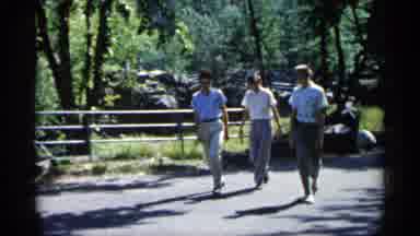 Minnesota USA (1961): Three Men Walk On Asphalt Pt On Sunny Day