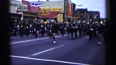 Minnesota USA (1961): Marching Band Marching Down Street In Parade