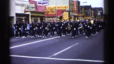 Minnesota USA (1961): Band Marching In Street Wearing Yellow And Black