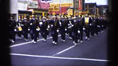 Minnesota USA (1961): Drummers Bet Drums S Marching Band Marches Down Center Of