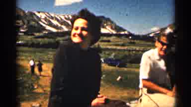 Colorado USA (1963): People Walking And Sitting At Foot Of Mountain