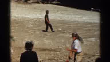 Colorado USA (1963): Woman Pretends To Wind Up Swing Father Pitching Baseball Inst