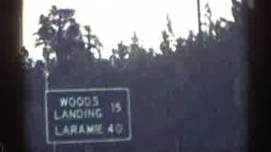 Colorado USA (1963): Green Lodging Mountings And Small Brown Wooden Sign On Cloudy