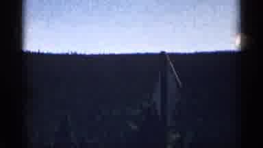 Colorado USA (1963): House Stands On Mountain Side Surrounded By Tall Trees