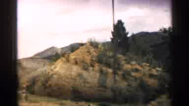 Colorado USA (1963): Approaching Mountains And Green Trees On Cloudy Day