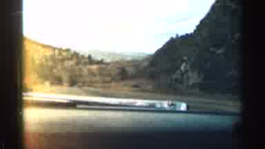 Colorado USA (1963): Two People In Car Driving Through Stouthearted Hills