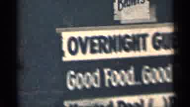 Colorado USA (1963): Traveling Down Rod Past Buildings Signs Overnight Guests And