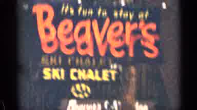 Colorado USA (1963): View Through Car Window Of Motels And Motel Signs With Trees