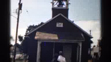Colorado USA (1963): Entrance Of Small Building With People Going Inside And Small