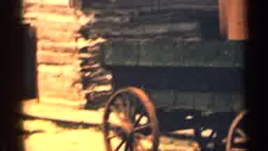 Colorado USA (1963): Wong With Big Wooden Wheels Sitting On Gravel Ground