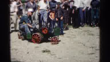 Montgomery Minnesota (1963): Grown Man Riding Baby Train Surrounded By Group Of